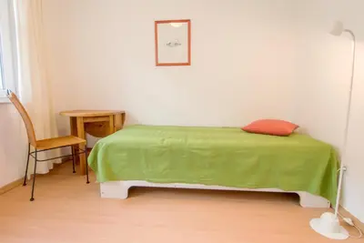 Ein Bett oder Betten in einem Zimmer der Unterkunft Appartementhaus Boddenblick - 