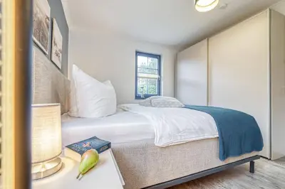 Ein Bett oder Betten in einem Zimmer der Unterkunft Birkmaase 10 - Wohnung 1