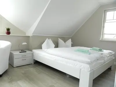 Ein Bett oder Betten in einem Zimmer der Unterkunft Haus Frieda