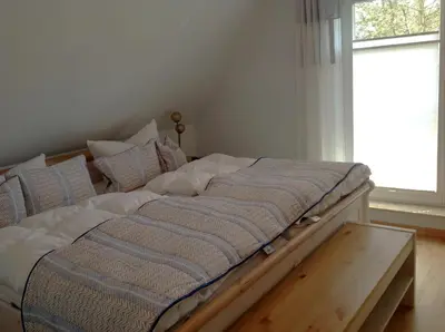 Ein Bett oder Betten in einem Zimmer der Unterkunft Haus Hedda