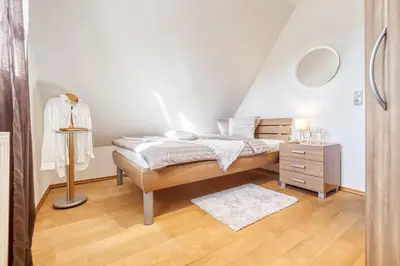 Ein Bett oder Betten in einem Zimmer der Unterkunft Haus Leni