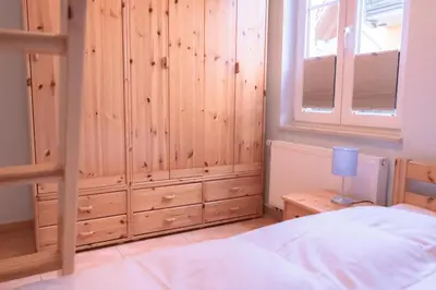 Ein Bett oder Betten in einem Zimmer der Unterkunft Haus Sabine - EG