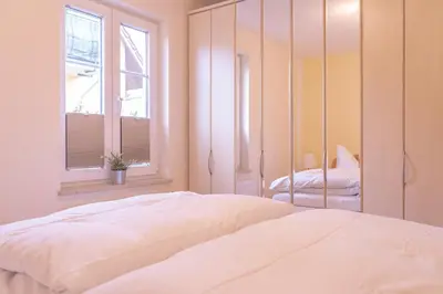 Ein Bett oder Betten in einem Zimmer der Unterkunft Haus Sabine - EG