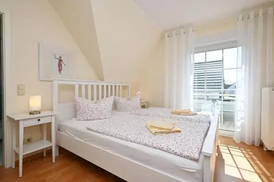 Ein Bett oder Betten in einem Zimmer der Unterkunft Hoppenberg 24 - Haus Sommerfeld