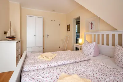 Ein Bett oder Betten in einem Zimmer der Unterkunft Hoppenberg 24 - Haus Sommerfeld