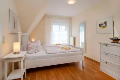 Ein Bett oder Betten in einem Zimmer der Unterkunft Hoppenberg 24 - Haus Sommerfeld