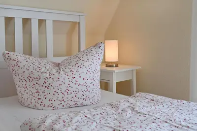 Ein Bett oder Betten in einem Zimmer der Unterkunft Hoppenberg 24 - Haus Sommerfeld