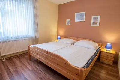 Ein Bett oder Betten in einem Zimmer der Unterkunft Hoppenberg 9 EG links