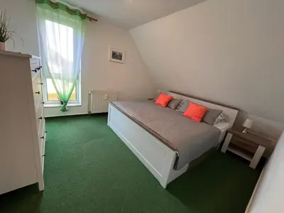Ein Bett oder Betten in einem Zimmer der Unterkunft Ferienwohnung Jonathan