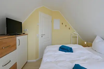 Ein Bett oder Betten in einem Zimmer der Unterkunft Kavelweg 13 Whg 5