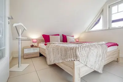 Ein Bett oder Betten in einem Zimmer der Unterkunft Kavelweg 9 Whg 5