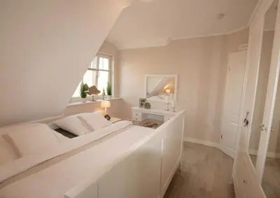 Ein Bett oder Betten in einem Zimmer der Unterkunft Neue Reihe 28 - Wohnung Kleine Auszeit
