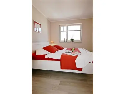 Ein Bett oder Betten in einem Zimmer der Unterkunft Neue Reihe 28 - Wohnung Kleine Auszeit