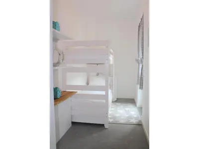 Ein Bett oder Betten in einem Zimmer der Unterkunft Logierhaus Friedrich WE 01 - 