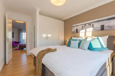 Ein Bett oder Betten in einem Zimmer der Unterkunft Logierhaus Friedrich WE 7 - 