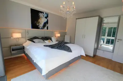 Ein Bett oder Betten in einem Zimmer der Unterkunft Logierhaus Friedrich WE 11 - 