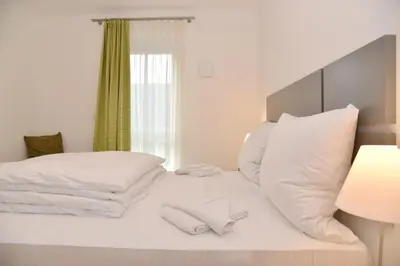 Ein Bett oder Betten in einem Zimmer der Unterkunft Logierhaus Friedrich WE 12 - 
