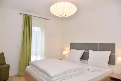 Ein Bett oder Betten in einem Zimmer der Unterkunft Logierhaus Friedrich WE 12 - 