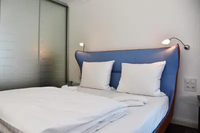 Ein Bett oder Betten in einem Zimmer der Unterkunft Logierhaus Friedrich WE 13 - 