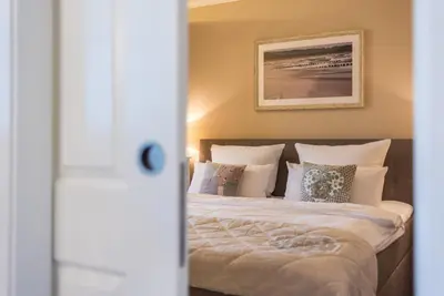 Ein Bett oder Betten in einem Zimmer der Unterkunft Logierhaus Friedrich WE 14 - 