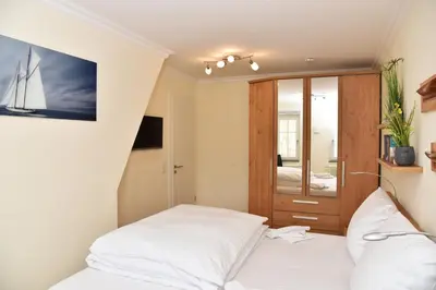 Ein Bett oder Betten in einem Zimmer der Unterkunft Logierhaus Friedrich WE 15 - 
