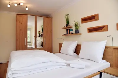 Ein Bett oder Betten in einem Zimmer der Unterkunft Logierhaus Friedrich WE 15 - 