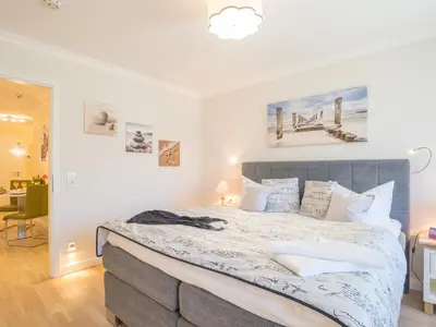 Ein Bett oder Betten in einem Zimmer der Unterkunft Logierhaus Friedrich WE 16 - 