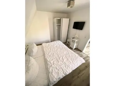 Ein Bett oder Betten in einem Zimmer der Unterkunft Wohnung Manu