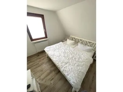 Ein Bett oder Betten in einem Zimmer der Unterkunft Wohnung Manu