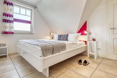 Ein Bett oder Betten in einem Zimmer der Unterkunft Mühlenstrasse 23 - Wohnung Boddenstern