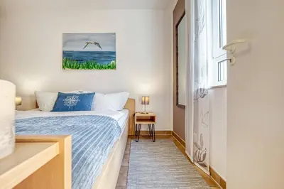 Ein Bett oder Betten in einem Zimmer der Unterkunft Residenz am Strand Backfisch - Wohnung 5-66