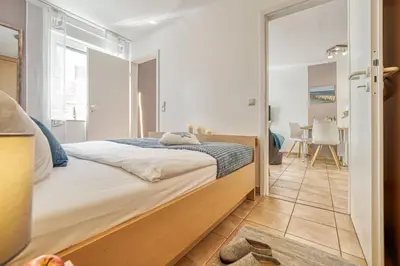 Ein Bett oder Betten in einem Zimmer der Unterkunft Residenz am Strand Backfisch - Wohnung 5-66