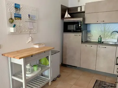 Küche/Küchenzeile in der Unterkunft Parkresidenz am Hafen Wohnung HF 11 - MeerZeit