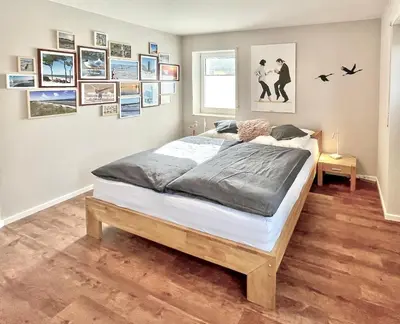 Ein Bett oder Betten in einem Zimmer der Unterkunft Parkresidenz am Hafen Wohnung HF 12 - Luftsnappers
