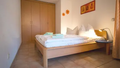 Ein Bett oder Betten in einem Zimmer der Unterkunft Residenz am Strand Wohnung 1-15
