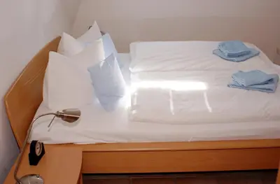 Ein Bett oder Betten in einem Zimmer der Unterkunft Residenz am Strand Wohnung 1-18