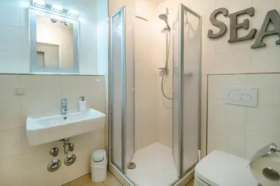 Ein Badezimmer in der Unterkunft Residenz am Strand Wohnung 2-29