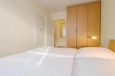 Ein Bett oder Betten in einem Zimmer der Unterkunft Residenz am Strand Wohnung 2-33