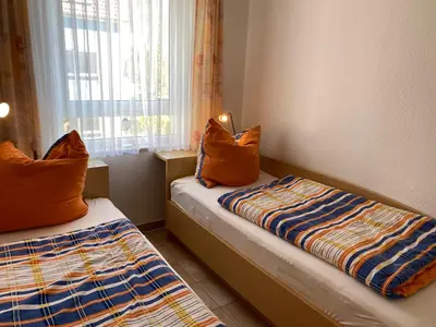 Ein Bett oder Betten in einem Zimmer der Unterkunft Residenz am Strand Wohnung 3-50