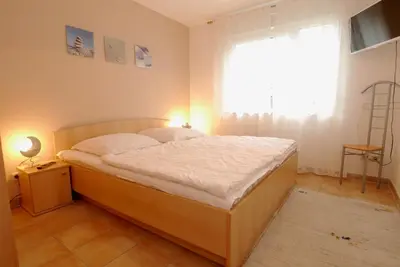 Ein Bett oder Betten in einem Zimmer der Unterkunft Residenz am Strand Wohnung 4-58
