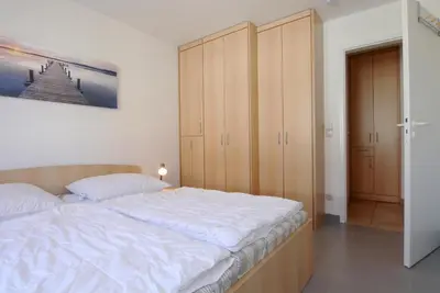 Ein Bett oder Betten in einem Zimmer der Unterkunft Residenz am Strand Wohnung 4-59
