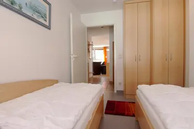 Ein Bett oder Betten in einem Zimmer der Unterkunft Residenz am Strand Wohnung 4-59
