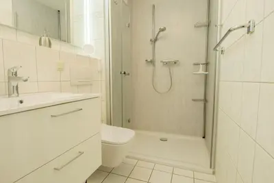 Ein Badezimmer in der Unterkunft Residenz am Strand Wohnung 4-60