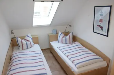 Ein Bett oder Betten in einem Zimmer der Unterkunft Residenz am Strand Wohnung 4-64