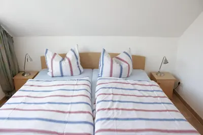 Ein Bett oder Betten in einem Zimmer der Unterkunft Residenz am Strand Wohnung 4-64
