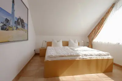 Ein Bett oder Betten in einem Zimmer der Unterkunft Residenz am Strand Wohnung 5-71