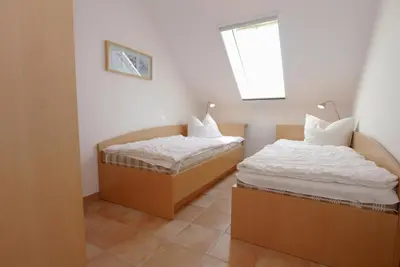 Ein Bett oder Betten in einem Zimmer der Unterkunft Residenz am Strand Wohnung 5-71