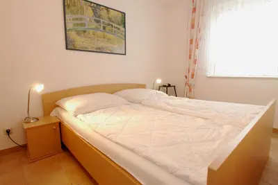 Ein Bett oder Betten in einem Zimmer der Unterkunft Residenz am Strand Wohnung 6-75