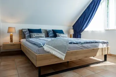 Ein Bett oder Betten in einem Zimmer der Unterkunft Residenz am Strand Wohnung 6-80
