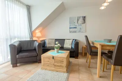 Ein Sitzbereich in der Unterkunft Residenz am Strand Wohnung 6-82